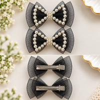 White Dahlia pearl outline bow hair clips Black